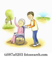 A boy helping an old woman in wheelchair A boy helping an old woman in wheelchair