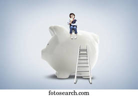 a boy on top of a piggy bank a boy on top of a piggy bank