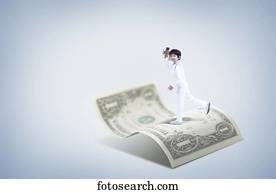 a boy standing on a dollar a boy standing on a dollar