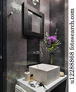 Mosaic tile wall in bathroom
