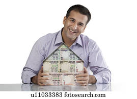 Man with a house model