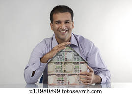 Man with a house model