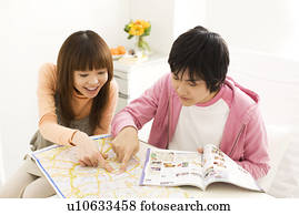 Couple in hospital making travel plans for the future