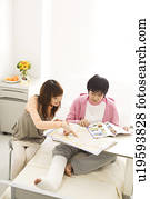 Couple in hospital making travel plans for the future