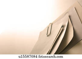 Memo held together with a paper clip