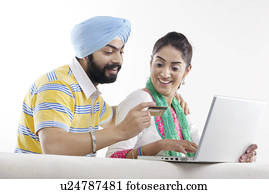 Couple with a laptop and credit card