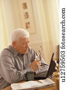 Senior working on laptop