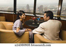 Well-Dressed Couple in Bar