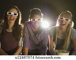 Young girls watching 3D movie