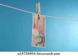 British paper currency on clothesline