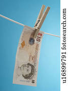 British paper currency on clothesline