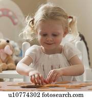 Young girl playing memory game