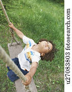 Carefree child swinging