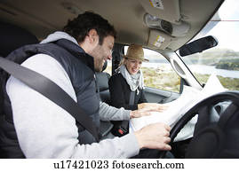 Happy couple in their car