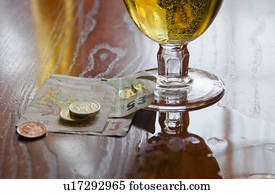 British currency and beer on table