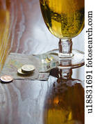 British currency and beer on table