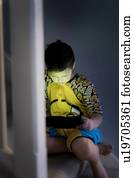 Young using handheld device