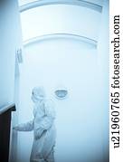 Scientist in an isolation suit