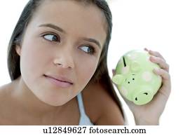 Teenage girl saving money