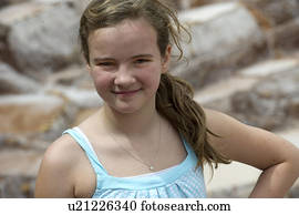 Portrait of a teenage girl at a salt mine, Maras, Salinas, Sacred Valley, Cusco Region, Peru