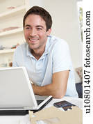 Young man working with laptop computer