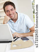 Young man working with laptop computer