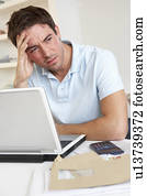 Young man working with laptop computer