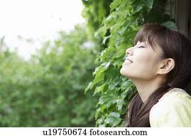 Young Woman Inhaling Fresh Air