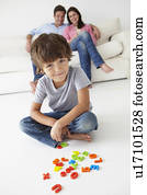 Parents watching son play