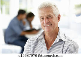 Senior businessman in office