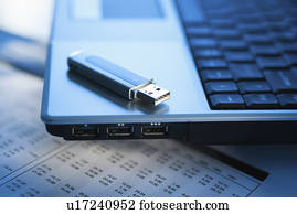 Studio shot of laptop with memory stick