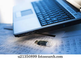 Studio shot of laptop with memory stick