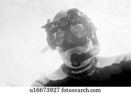 Scuba diver swimming underwater, Puerto Egas, Santiago Island, Galapagos Islands, Ecuador