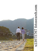 Senior Couple Walking by River