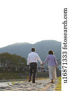 Senior Couple Walking by River