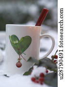 Cup with heart-shaped imprint and twig