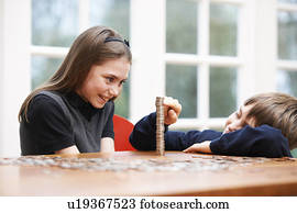 Children counting a pile of money