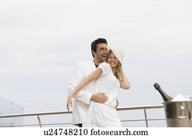 https://cdn-grid.fotosearch.com/ULY/ULY171/couple-on-yacht-stock-photography__u24748210.jpg