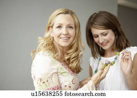 Pride mother with daughter in jewelry