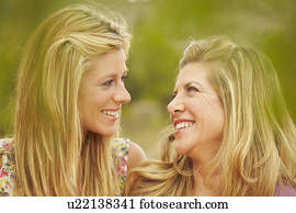 Mother & daughter smiling at each other