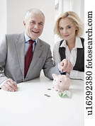 Man and woman saving money