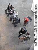 Woman with red dress is joining line