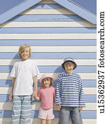 Children in front of beach hut