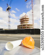 Safety hat & Plans Outside Building Site