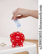 saving money in piggy bank