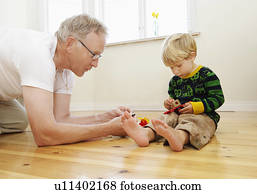 Grandfather playing with grandson