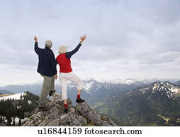 senior couple on mountain summit