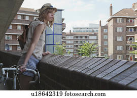 Woman looking over balcony