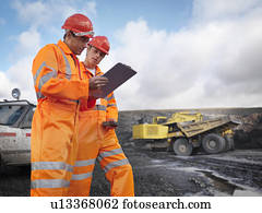 Workers With Clipboard In Coal Mine