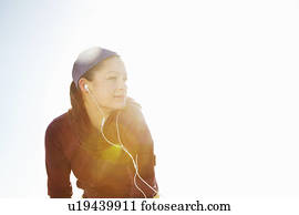 Portrait of sporty woman with lens flare